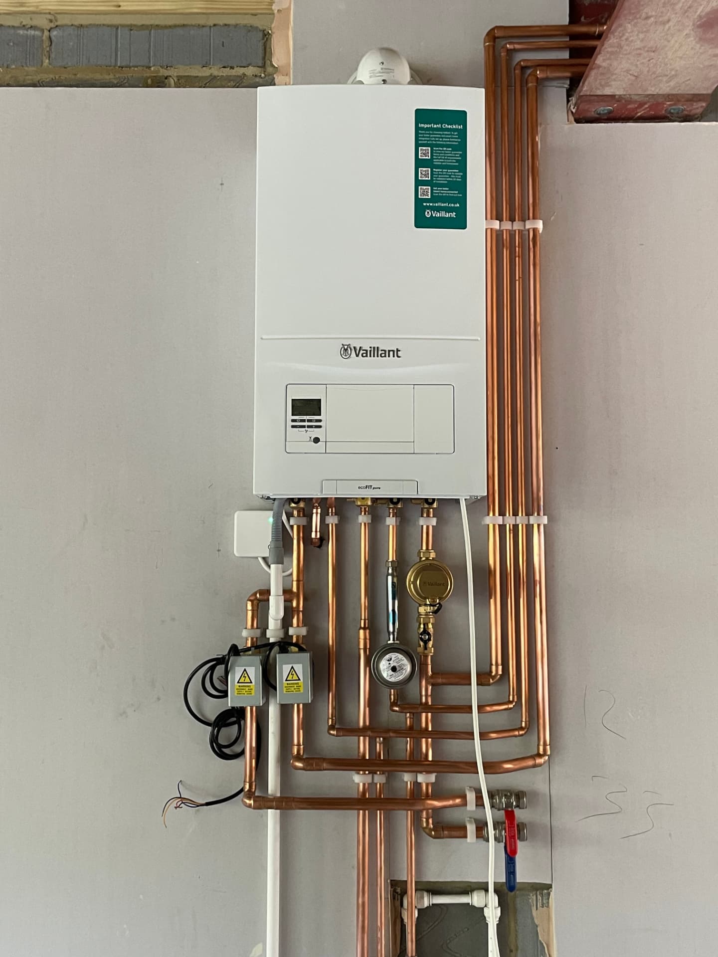 Boiler installation by Phaze One with neat copper pipework in a Surrey home